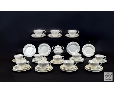 Wedgwood Of Etruria 35 Piece Part Tea Service Circa 1920's/30's In Queensware embossed cream colourway design. Comprises 10 t