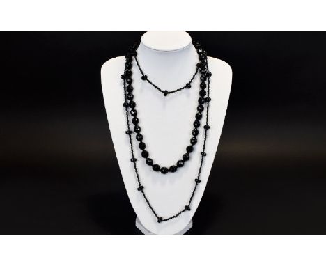 Vintage Glass Beaded Necklace A short necklace comprised of multiple faceted glass beads fashioned to emulate jet. Also a lon