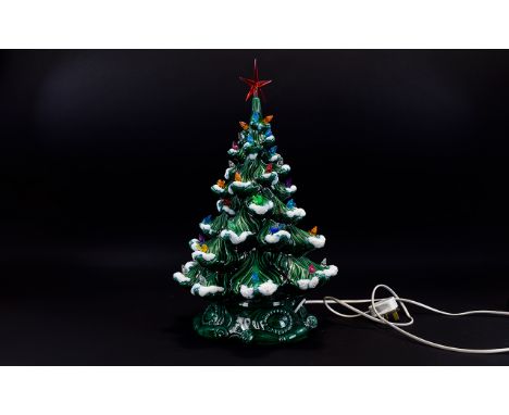 Green Ceramic Christmas Tree Lamp decorated throughout with plastic bird figures and star to top.  20 inches in height,