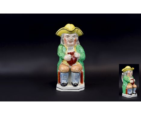 Staffordshire Early 19th Century Toby Jug, Gentleman Holding a Large Jug of Ale and Clay Pipe, Wearing a Yellow Tricorn Hat w