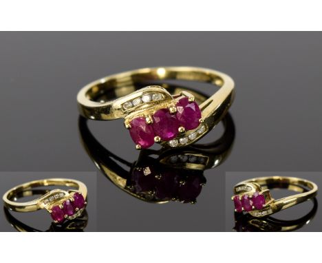 9ct Gold, Diamond and Ruby Cluster Ring, 3 Ruby's set on a twist between 8 channel set diamonds.