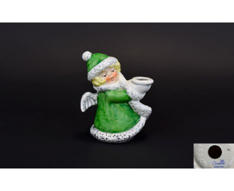 Goebel Angel Candle Holder Small ceramic candle holder in the form of a whimsical Christmas angel dressed in a green cape and