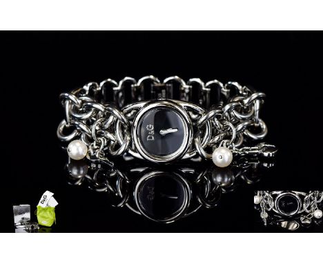 Ladies Contemporary Fashion Watch By D&G Silver tone chunky bracelet watch with black dial and silver tone hands. The bracele