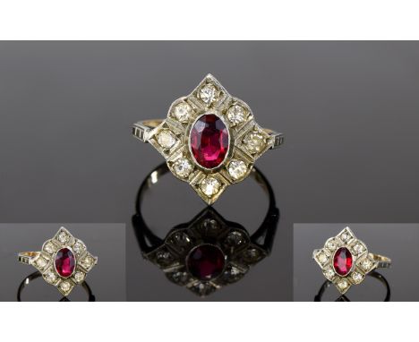 Antique - Nice Shaped 9ct Gold Shank and Silver Set Ruby and Diamond Ring. The Ruby Surrounded by 8 Old Cut Diamonds. The Rub