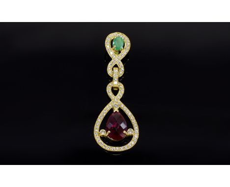 Continental 18ct Gold Pendant Drop, set With A Green Emerald And Ruby Coloured Stone Surrounded By White Sapphires.