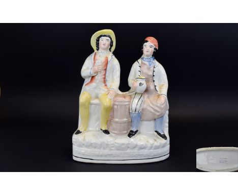 Staffordshire 19th Century Figure Group of Tam O'Shanter and His Friend Souter Johnnie. The Two Men Art Seated Either Side of