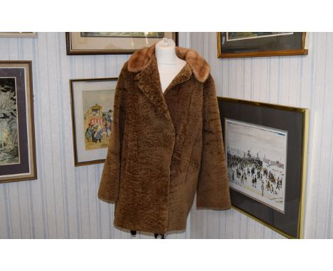 Astrakhan Vintage Coat Three quarter brown Persian lamb coat, front patch pockets, revere collar and covered button fastening