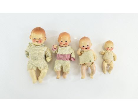 Early 20th Century Rare Bisque Infant Dolls Four in total, fully jointed with bisque head and body each in original cloth out