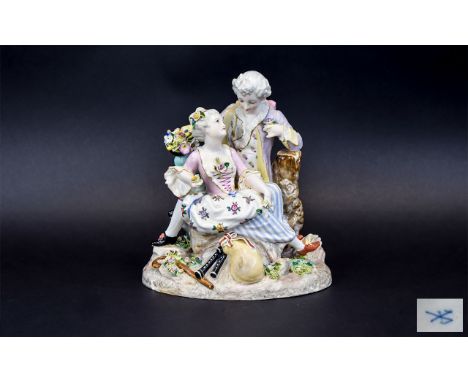 After Meissen Romantic Figure Group showing a young couple in 18thC dress, in a countryside setting, seated as if in a 'love 