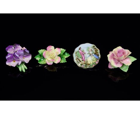 A Collection Of Ceramic Floral Posy Brooches Four in total to include Bairstow China tea rose, Denton china posy of violets, 