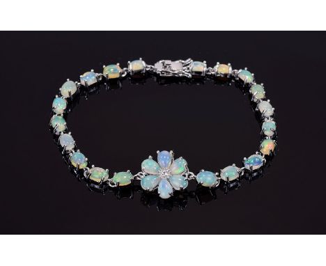 Opal Flower Centred Line Bracelet, the bracelet set with oval cut cabochon opals and the flower with pear cut cabochon opals 