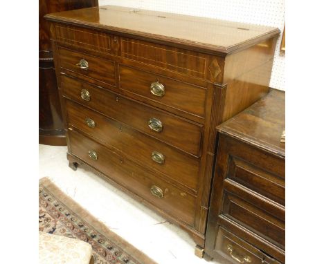 A 19th Century mahogany chest, the upper section with rising top over two dummy drawers and three long graduated drawers to o