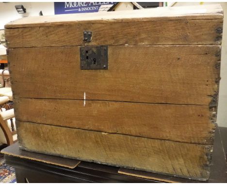 A pine dome top trunk with iron handles and lock