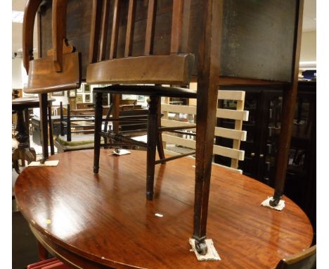 A mahogany oval dining table, a nest of three oak coffee tables, a walnut centre table with turned and carved pedestal to thr