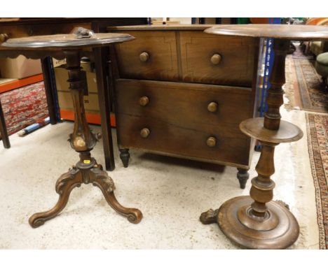 A 19th Century mahogany circular table, with column support and a small circular mid tier, on a turned base and three paw fee