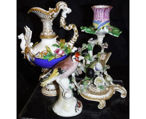 A Coalport decorative ewer with gilt and floral encrusted decoration, the handle formed as a maiden, the body with Griffin an