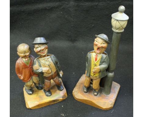 A 20th Century Continental carved wooden automaton lamp as a gentleman whistling, together with an Italian carved bottle open