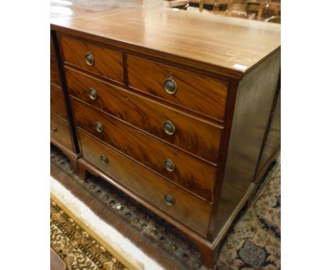An early 20th Century mahogany chest of two short over three long drawers, to bracket feet
