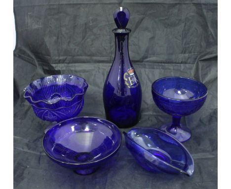 A collection of cranberry, ruby and Bristol blue glass wares to include vases, bells, scent bottles, candlesticks etc