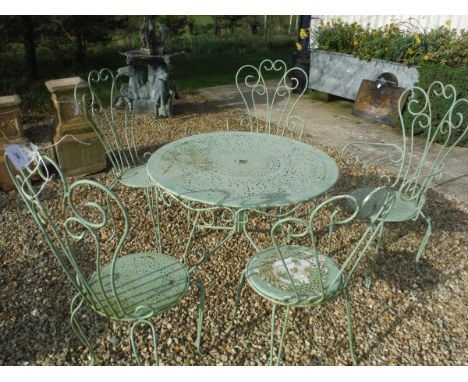 A painted metal garden table and five chairs (2 +3) and an extending ladder