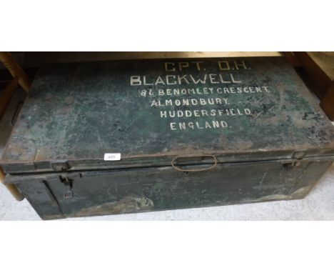 A painted tin trunk inscribed "CPT. D.H Blackwell 86 Benomley Crescent Almondbury Huddersfield England", containing a copy of