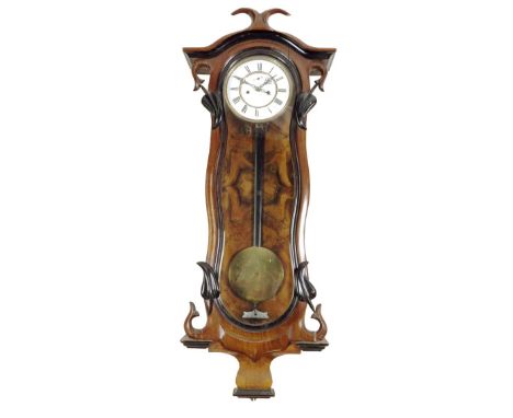 A German Vienna regulator, movement numbered 13164, two-piece white enamel dial in a walnut veneered case, the shaped trunk w
