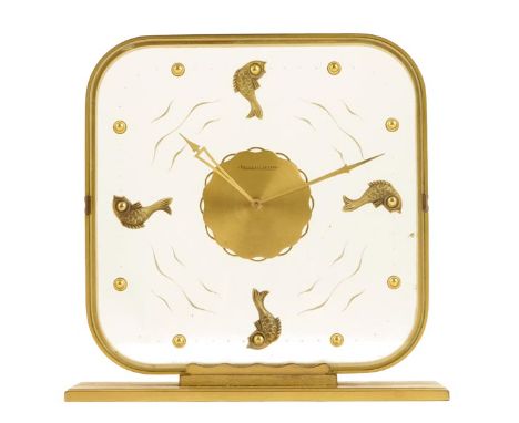 Jaeger LeCoultre. A gilt brass and perspex mantel timepiece, the eight day movement set in the transparent dial, fish set car