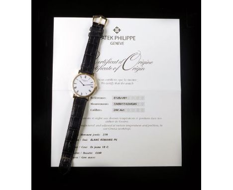 Patek Philippe. An 18ct yellow gold automatic Calatrava wristwatch with all paperwork, Ref. 5120J, movement no. 1206877, the 