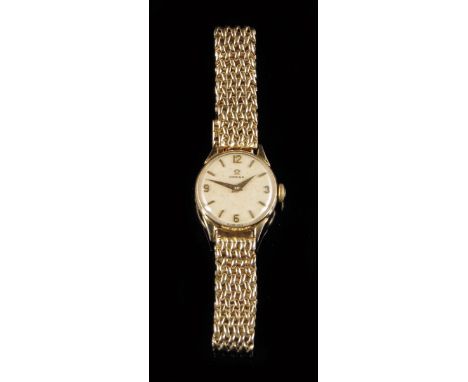 Omega. A 9ct gold lady's wristwatch, silvered dial signed Omega with raised baton and cardinal numerals, Calibre 245 movement