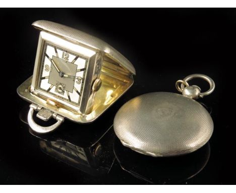 A continental silver hunting cased verge watch, winding through the white enamel dial, in a guilloche case, 40mm diameter; an