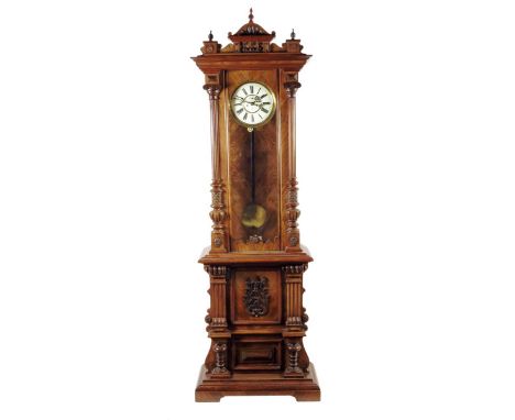 A German walnut longcase clock, the two-piece cream enamel dial with the trademark for Gustav Becker, subsidiary seconds, the