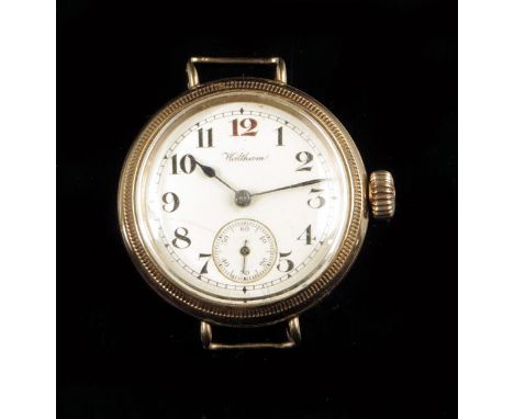 A 9ct gold wristwatch, the damascened nickel lever movement by A.W.W. Co, Waltham, no. 18804450, signed white enamel dial wit