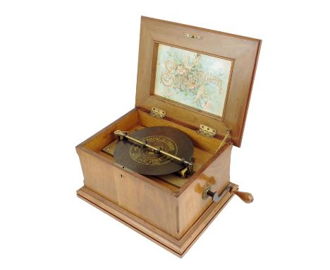 An 8.25 inch walnut cased symphonion disc musical box, the centre drive movement with twin combs, signed Schutz-Marke Symphon