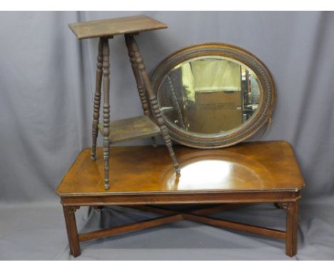 REPRODUCTION WALNUT COFFEE TABLE, a vintage two-tier side table with bobbin turned decoration and an oval framed bevelled edg