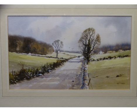 R WITCHARD watercolour - rural lane with farmstead and two figures on a track, signed, 23 x 39cms