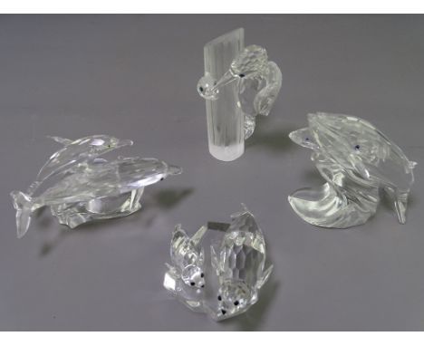 FOUR SWAROVSKI CRYSTAL ORNAMENTS - Michael Stamey 'Mother and Child' series, 'Lead me Dolphins', 'Save me Seals', 'Care for m