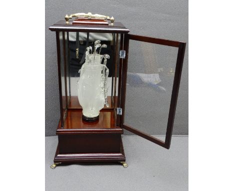 GOLFING INTEREST DISPLAY, a glass form golf bag containing clubs, in a mirror- back glass and mahogany effect display stand, 