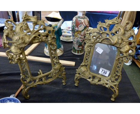 Pair of brass easel photo frames depicting George and The Dragon in relief