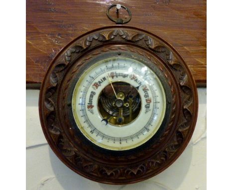 Black Forest carved wooden framed aneroid barometer