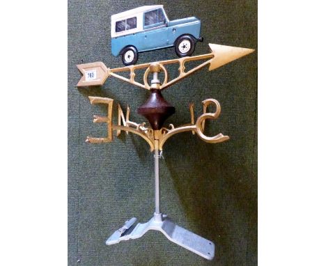 Cast metal weather vane with Land Rover design