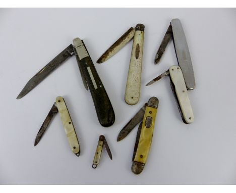 Seven pocket knives including one with a mother of pearl handle