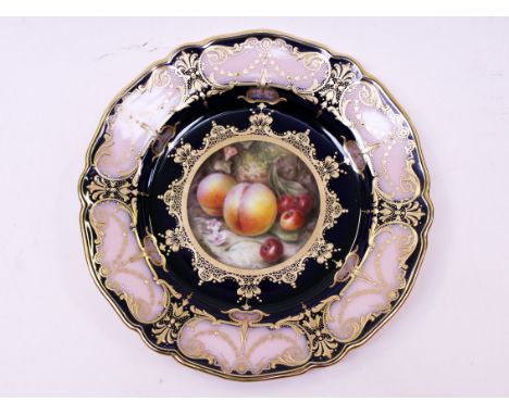 A Royal Worcester plate decorated with fruit within a foliate border on blue ground signed R Sebright. Diam. 22.5cm. Conditio