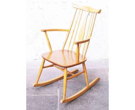 An Ercol light elm and beech rocking chair. H89cm