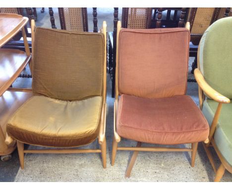 A pair of Ercol light elm and beech lounge chairs
