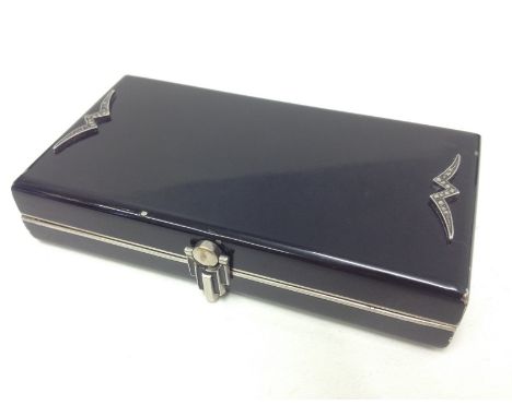 An Art Deco chrome and black compact. L10.5cm. Condition - minor loss to black, general wear to include minor marks and scrat