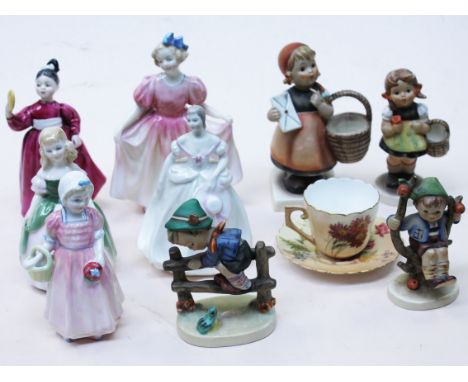 A mixed lot comprising four Royal Doulton figures and another, four Hummel figures and a Royal Worcester cup and saucer. Cond