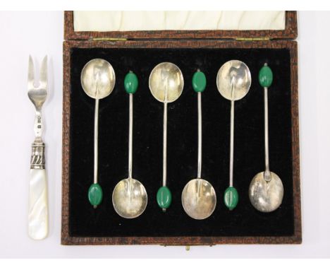 A set of hallmarked silver bean spoons and a hallmarked silver pickle fork