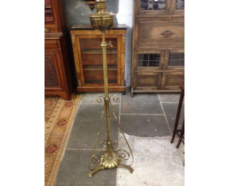 An Arts & Crafts style adjustable brass oil lamp.