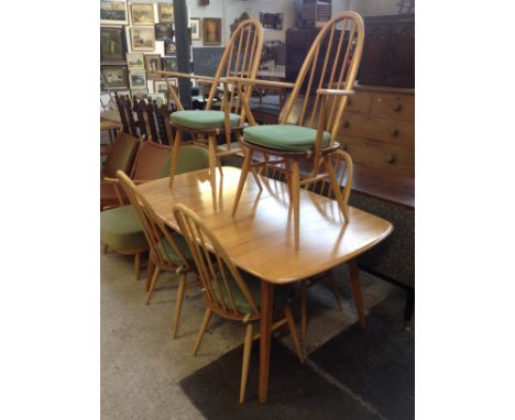 An Ercol light elm and beech extending table with two leaves and six chairs. Table Dimensions when closed W90cm L152cm H72cm