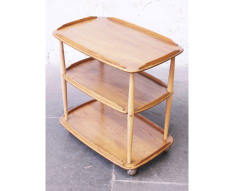 An Ercol light elm and beech three trier trolley. H74cm